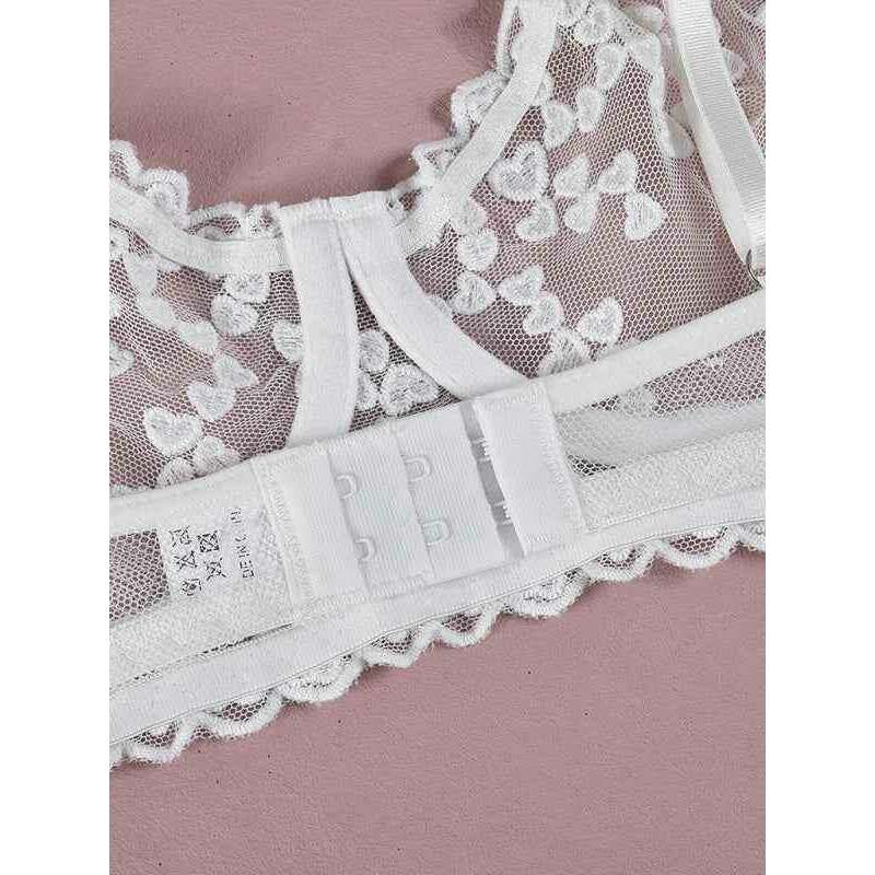 White embroidered mesh lingerie set with delicate lace detailing and adjustable straps
