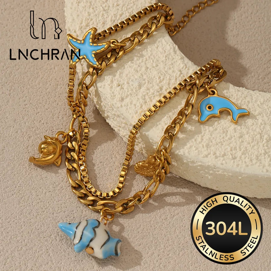 18K Gold Dolphin & Fish Charm Bracelet