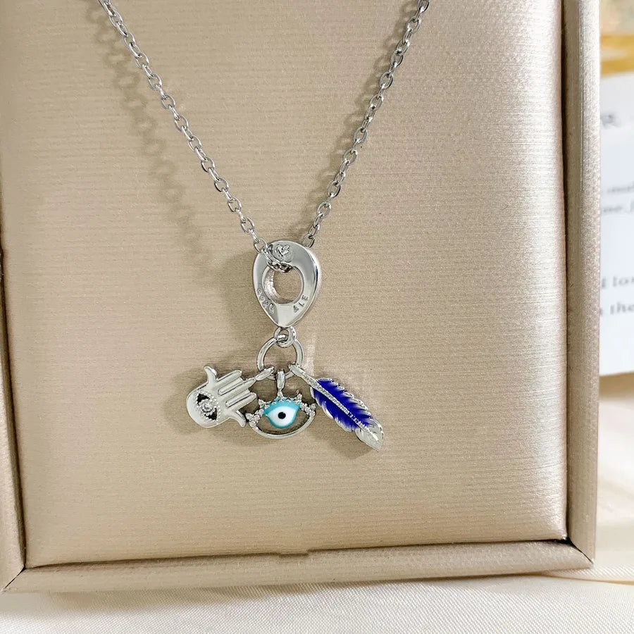 Global Travel Pendant Necklace for Women XL3883 Eye Feather Necklace Silver