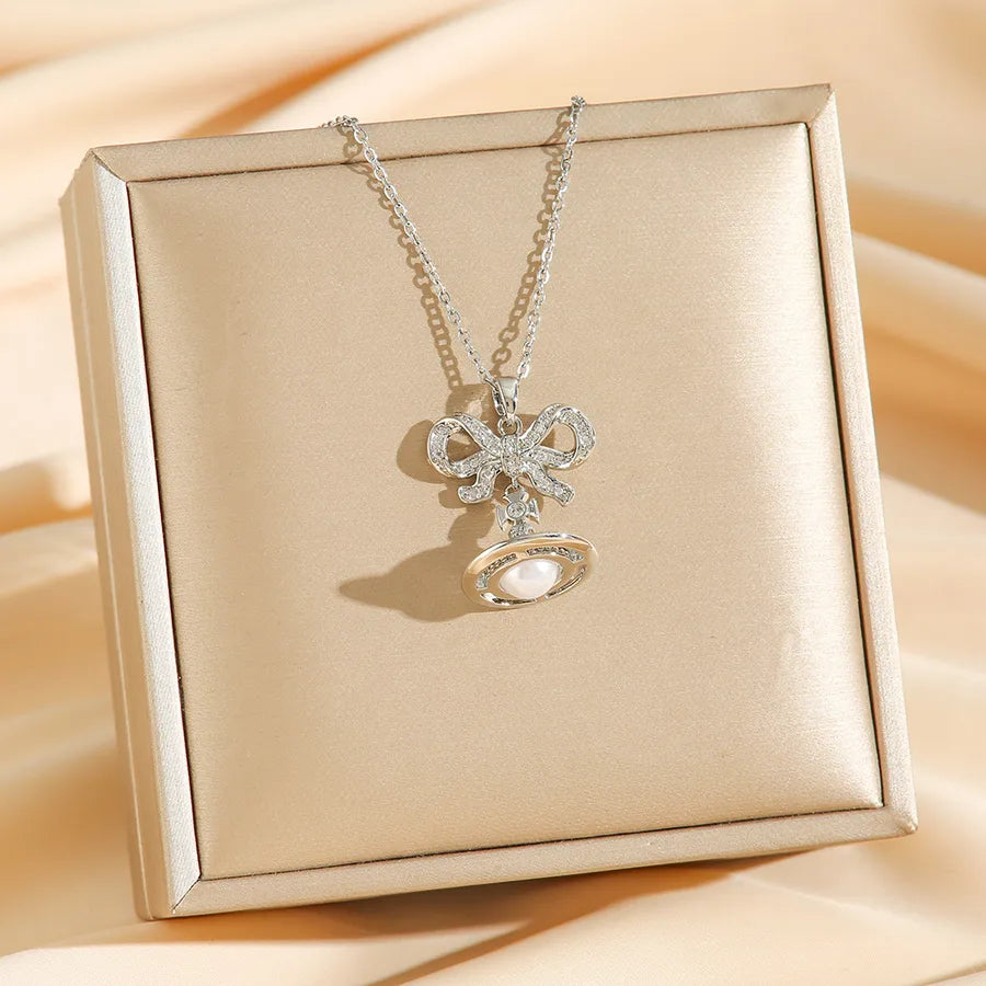 Titanium Steel Saturn Necklace with Pearl Drop 8739 Silver Bow Planet