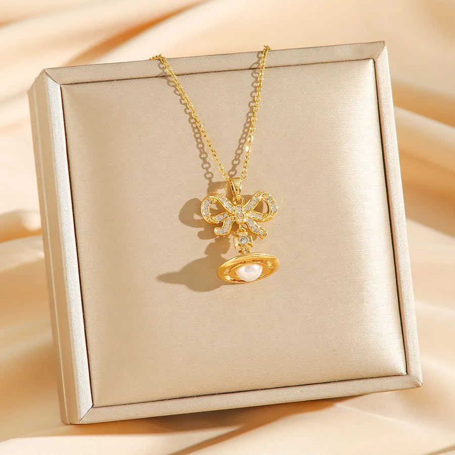 Titanium Steel Saturn Necklace with Pearl Drop 8739 Gold Bow Planet