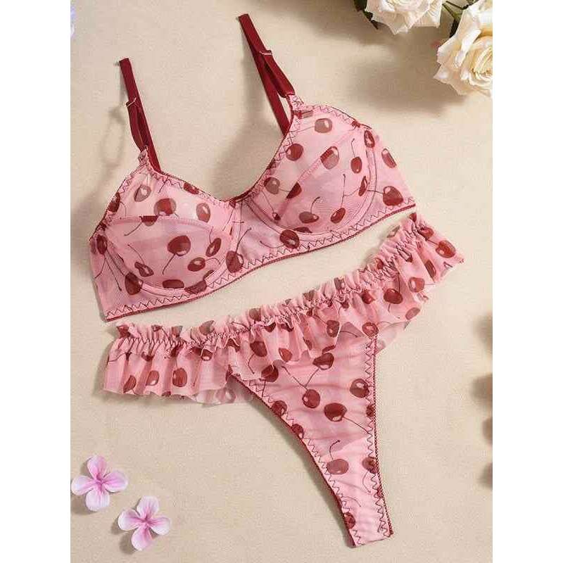 Women's lingerie set by Smiling Maria featuring a cherry-print bra and ruffle thong in soft pink