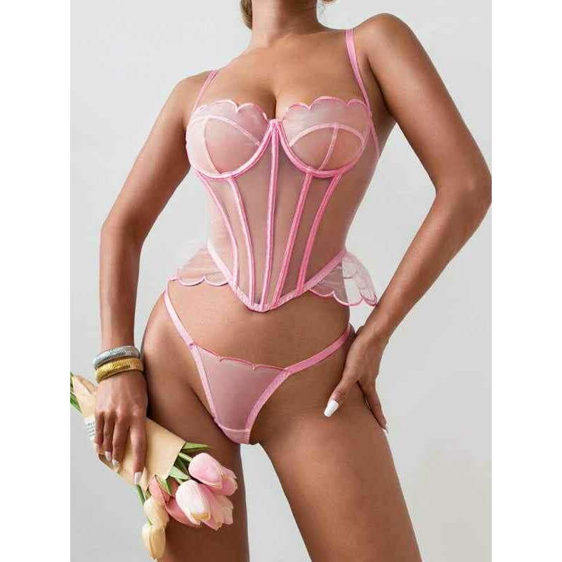 Elegant romantic mesh lingerie set with a corset style top and matching thong, in soft pink color