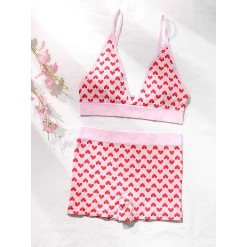 Smiling Maria Valentine's lingerie set for women featuring a heart print bralette and matching shorts