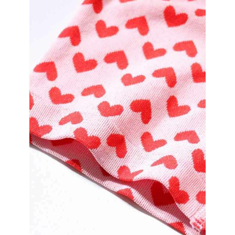 Smiling Maria Valentine's lingerie set for women featuring a playful pink fabric with red hearts