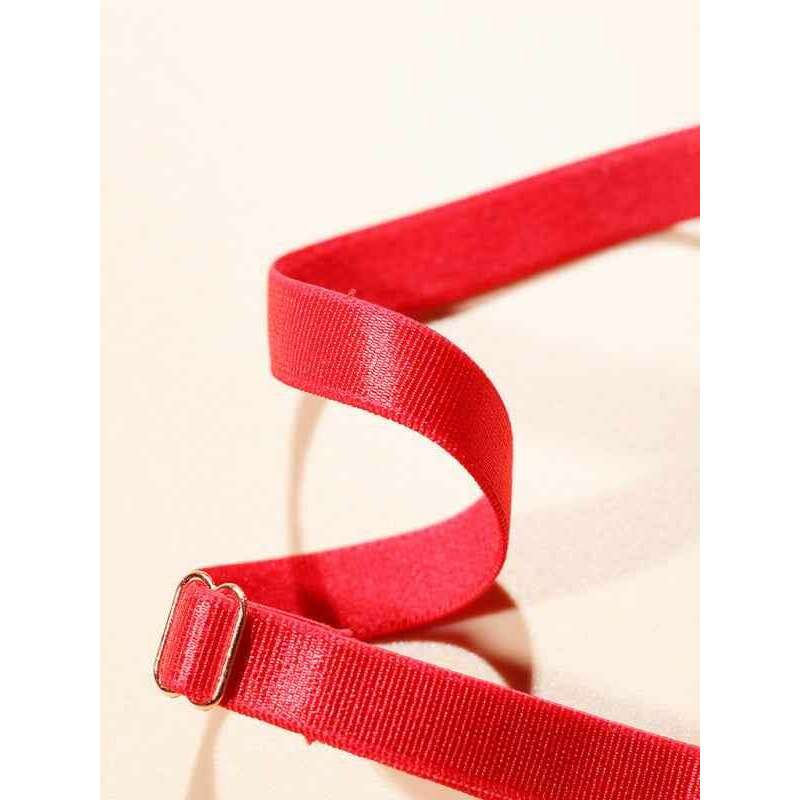 Close-up of the strap of a Valentine's red heart lingerie set showcasing soft material and adjustable features